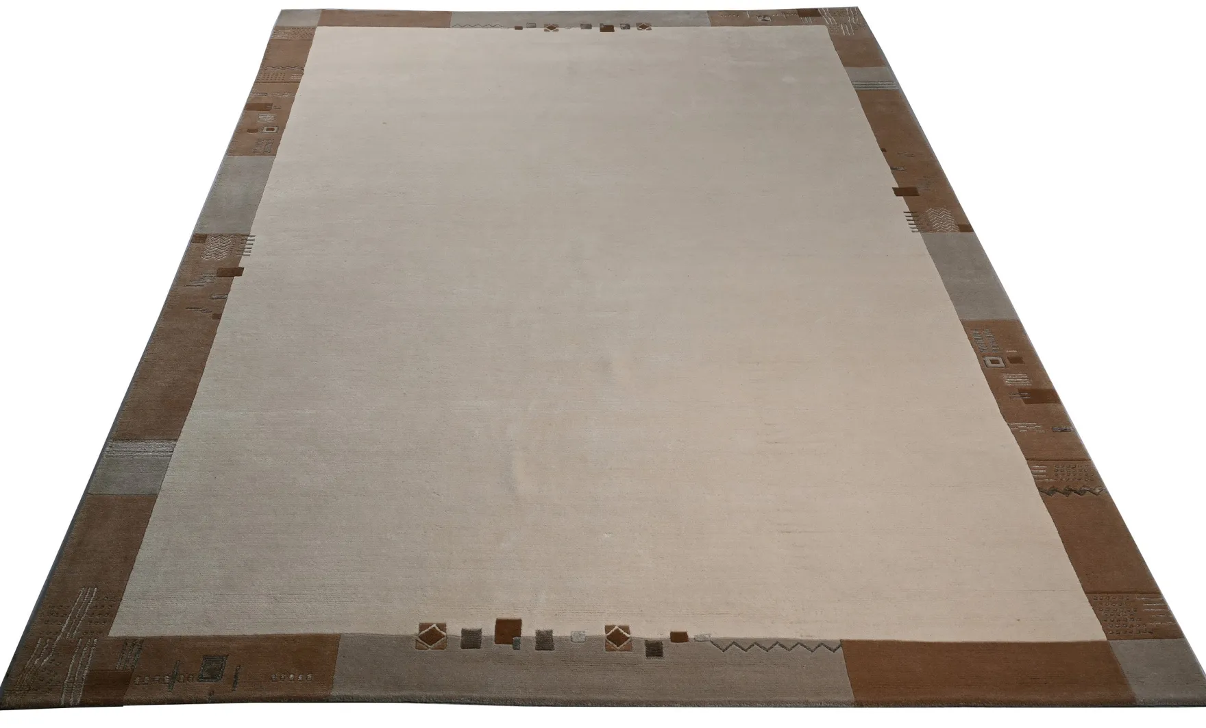 Handgeknüpfter Tibeter Teppich in beige mit Retro Bordüre – Neuwertig