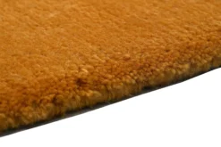 Handgeknüpfter tibeter Teppich in gold gelb mit Retro Bordüre – Neuwertig