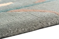Handgeknüpfter Tibeter Teppich in grün mit Retro Bordüre – Neuwertig