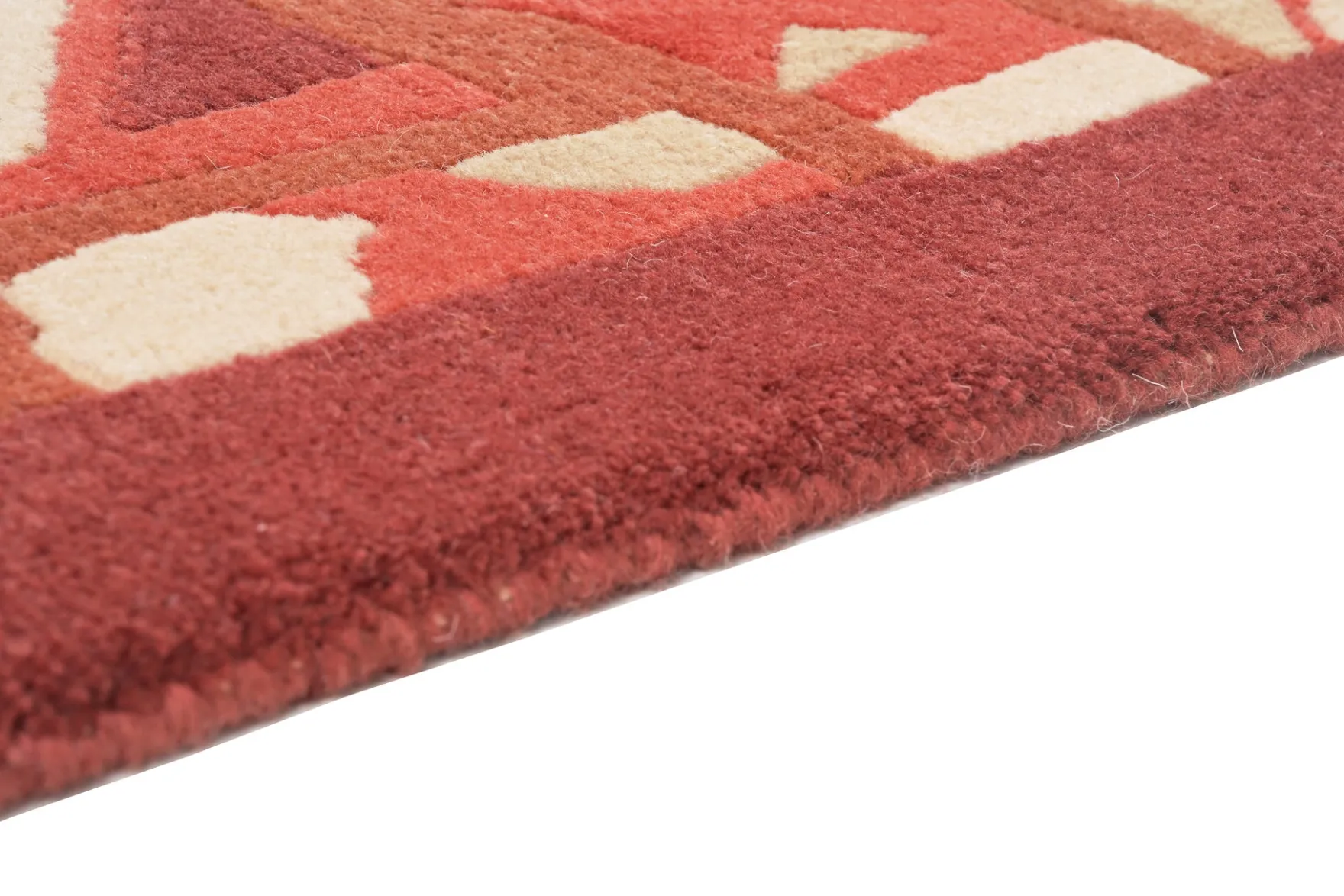 Handgeknüpfter tibetischer Teppich in rot mit Retro Bordüre – Neuwertig