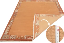 Handgeknüpfter Tibet Teppich in Apricot mit Retro Bordüre – Neuwertig